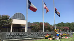 A police precinct in city of Dallas receives flowers as the city mourns the loss of police officers killed in a mass shooting on July 7, 2016.