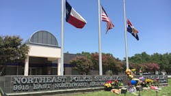 A police precinct in city of Dallas receives flowers as the city mourns the loss of police officers killed in a mass shooting on July 7, 2016. A police precinct in city of Dallas receives flowers as the city mourns the loss of police officers killed in a mass shooting on July 7, 2016.