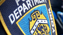 A NYPD officer was saved by his bulletproof vest Sunday night after a gunman shot him in the chest at a Brooklyn apartment building