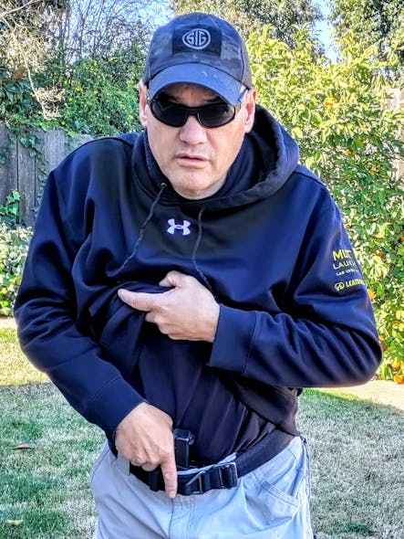The Appendix Carry draw gets the non-firing hand in a natural position for the draw. There are several options: Hook the material from the beltline and rip, grab a handful of clothing and rip up, or a combination of both. Most of these methods get the non-firing hand near the sternum, which is ideal for a balanced draw.