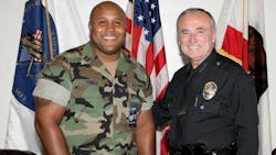 Christopher Dorner, left, is seen with former Los Angeles Police Chief William Bratton Christopher Dorner, left, is seen with former Los Angeles Police Chief William Bratton