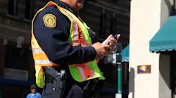 Officer Standing With Cell Phone