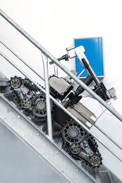 Telerob's telemax EVO PLUS rolls up a flight of steps. Telerob's telemax EVO PLUS rolls up a flight of steps.