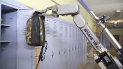 Telerob&apos;s telemax EVO PLUS is seen lifting a backpack inside a school.