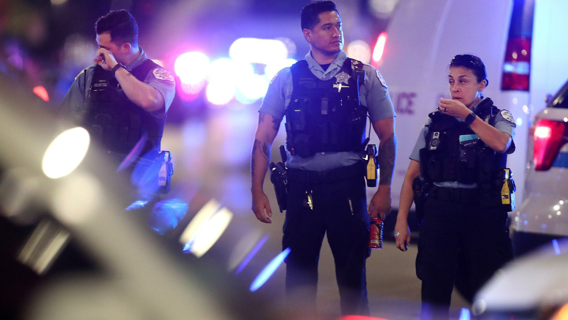 Chicago police work the scene near where two officers were shot at West 63rd Street and South Bell Avenue in Chicago on Aug. 7.