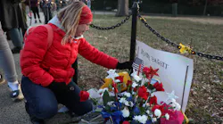 Melody Black becomes emotional as she visits a memorial setup near the U.S. Capitol Building for Ashli Babbitt, who was killed in the building after a pro-Trump mob broke in, on Jan. 6.