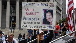 A protester holds a sign about Ashli Babbitt while participating in a political rally on July 25 in New York City. A protester holds a sign about Ashli Babbitt while participating in a political rally on July 25 in New York City.