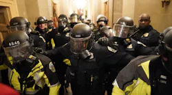 Riot police clear the hallway inside the Capitol on Jan. 6 in Washington, DC.