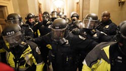 Riot police clear the hallway inside the Capitol on Jan. 6 in Washington, DC. Riot police clear the hallway inside the Capitol on Jan. 6 in Washington, DC.
