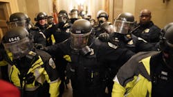 Riot police clear the hallway inside the Capitol on Jan. 6, 2021, in Washington, D.C. Riot police clear the hallway inside the Capitol on Jan. 6, 2021, in Washington, D.C.