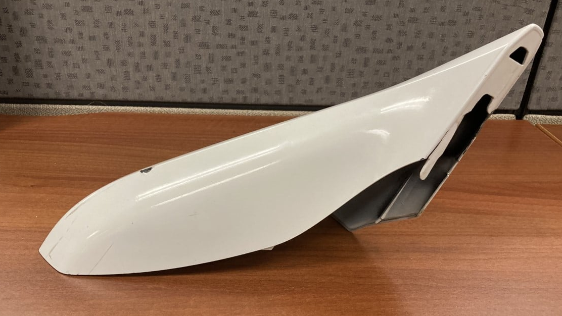 The side mirror from a Chevrolet Camaro that struck a Clayton County, GA, police officer trying to break up a group of street racers Saturday.