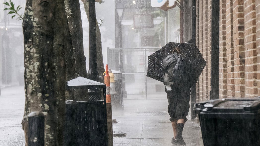 A person walks through the French Quarter ahead of Hurricane Ida on Sunday in New Orleans.