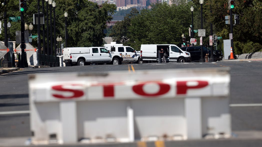 First responders arrive on the scene to investigate a report of an explosive device in a pickup truck near the Library of Congress on Capitol Hill on Thursday in Washington, D.C.