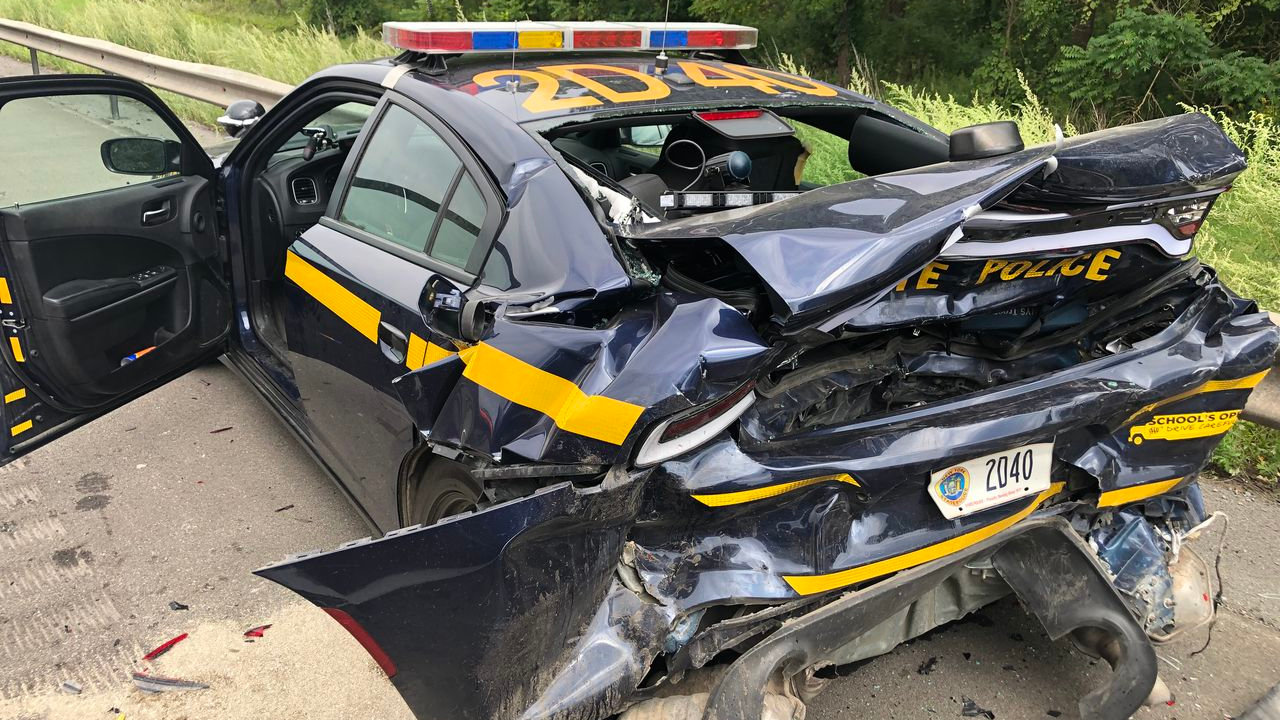 A chain reaction accident forced a New York State Police trooper to dive out of the way of his own patrol call during a traffic stop in Onondaga, NY, on Saturday.