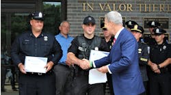 Worcester, MA, police Officer Timothy Foley (left) and Officer Daniel Pennellatore are recognized by District Attorney Joseph D. Early Jr. on Monday.