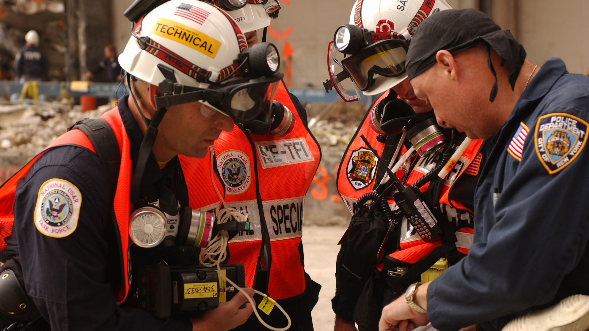 Urban Search and Rescue team members review site maps at the World Trade Center in New York City on September 28, 2001.