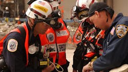 Urban Search and Rescue team members review site maps at the World Trade Center in New York City on September 28, 2001. Urban Search and Rescue team members review site maps at the World Trade Center in New York City on September 28, 2001.