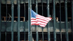 An American flag is flying at half mast above the rubble of the World Trade Center in New York City on September 27, 2001. An American flag is flying at half mast above the rubble of the World Trade Center in New York City on September 27, 2001.
