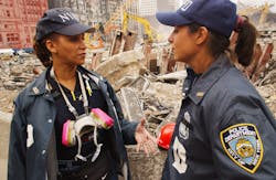 NYPD officers help keep order at the World Trade Center in New York City on September 27, 2001. NYPD officers help keep order at the World Trade Center in New York City on September 27, 2001.