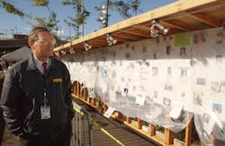 A FEMA employee views the wall of people still missing from the World Trade Center attacks in New York City.