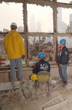 Members of the NYPD look at the wreckage of the World Trade Center from adjoining building in New York City on September 20, 2001. Members of the NYPD look at the wreckage of the World Trade Center from adjoining building in New York City on September 20, 2001.