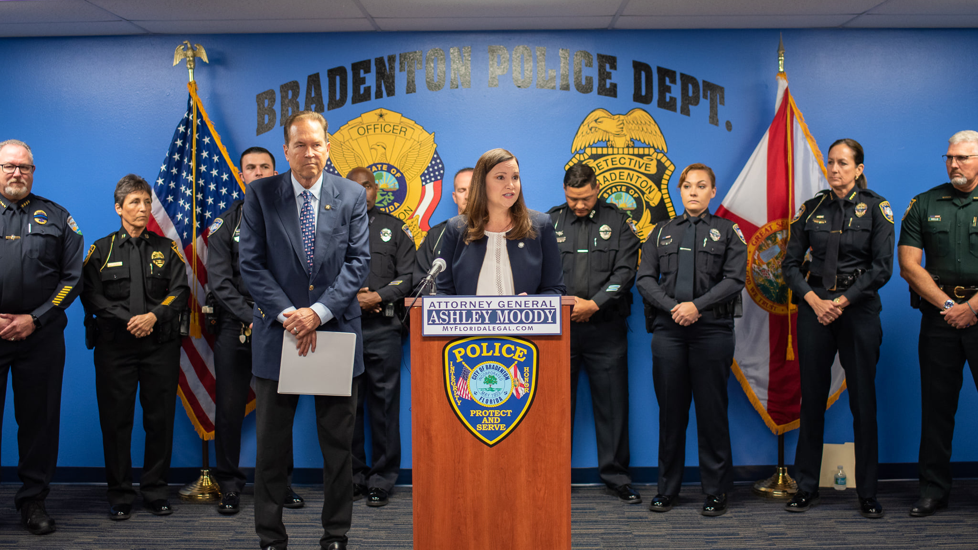 Florida Attorney General Ashley Moody holds a press conference to discuss the Thin Blue Line Act with the bill's sponsor, U.S. Rep. Vern Buchanan (left) at the Bradenton Police Department on Monday.