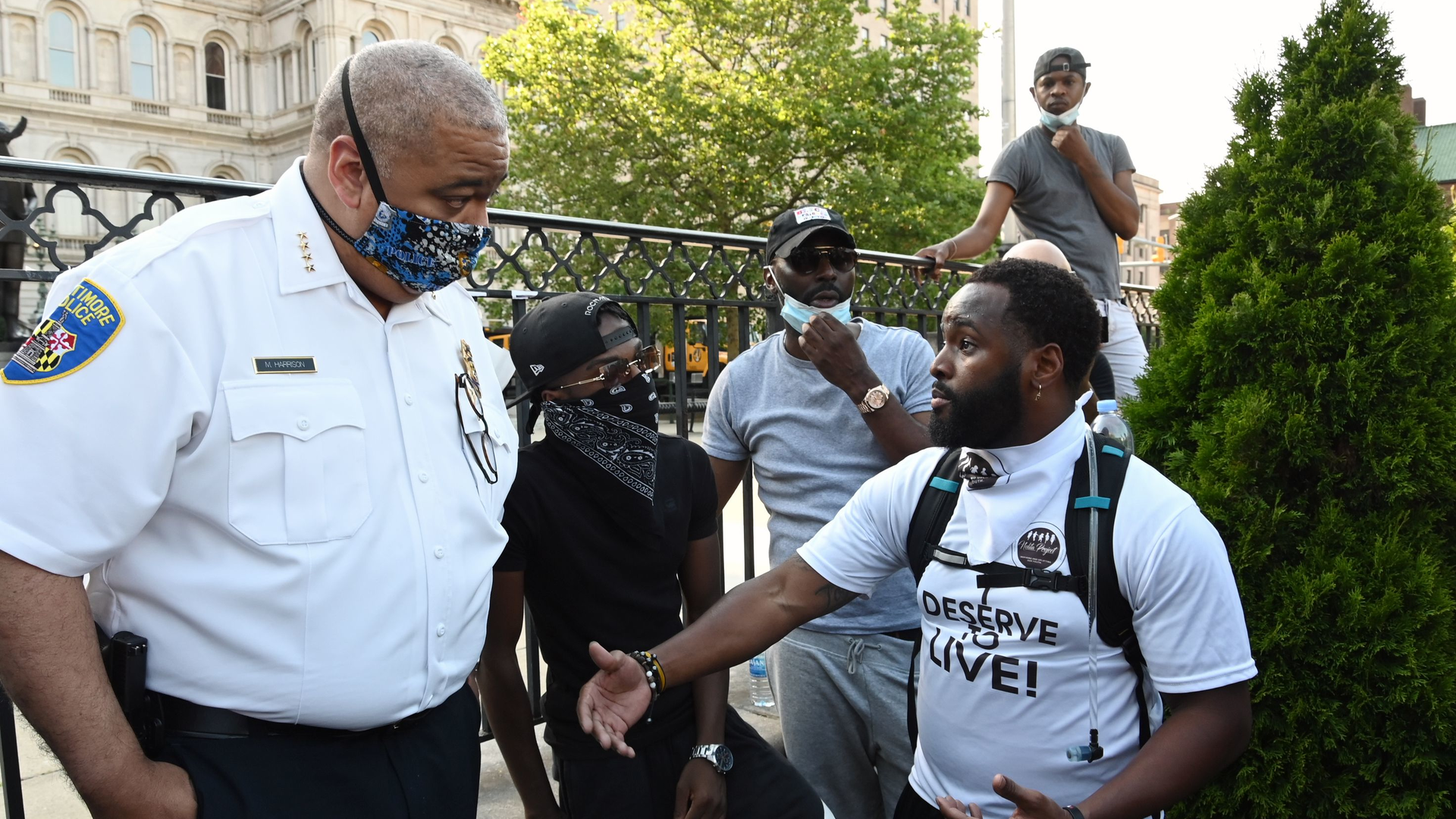 Baltimore Police Commissioner Michael Harrison listens to a question from Wesley Hawkins of The Nolita Project at a rally at CIty Hall to remember George Floyd and other African Americans killed by police and demand change. June 4, 2020.
