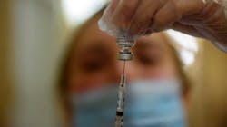 Pharmacist Tara Hubbard prepares a COVID-19 vaccination in hallway of The Retreat, a Community Renewal Team assisted-living facility in Hartford, CT, on Jan. 15. Pharmacist Tara Hubbard prepares a COVID-19 vaccination in hallway of The Retreat, a Community Renewal Team assisted-living facility in Hartford, CT, on Jan. 15.