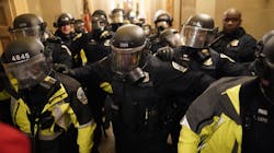 Riot police clear the hallway inside the Capitol on Jan. 6 in Washington, D.C. Riot police clear the hallway inside the Capitol on Jan. 6 in Washington, D.C.