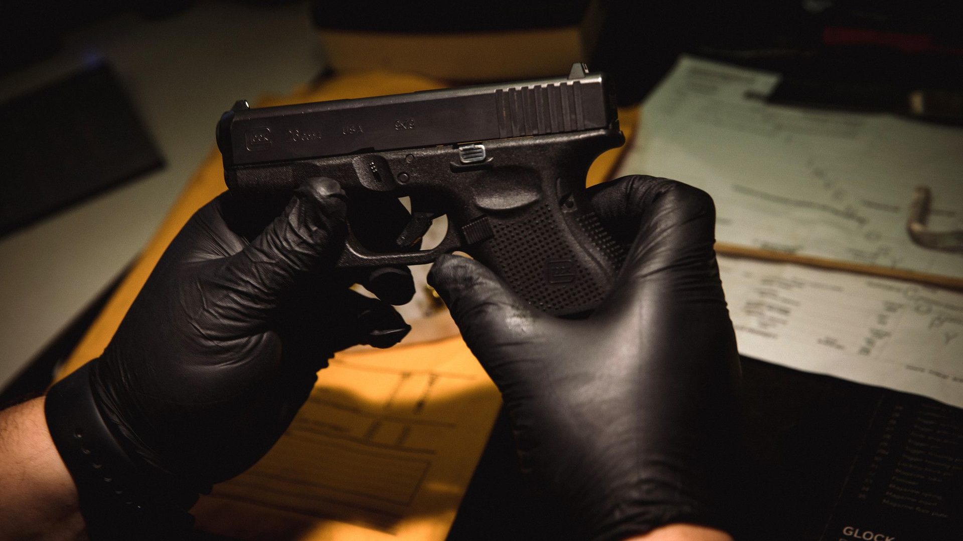 Evidence technician Christopher Lenti inventories a Glock 9mm at the Chicago police firearms laboratory at the CPD Homan Square police facility on June 9.