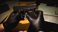 Evidence technician Christopher Lenti inventories a Glock 9mm at the Chicago police firearms laboratory at the CPD Homan Square police facility on June 9.