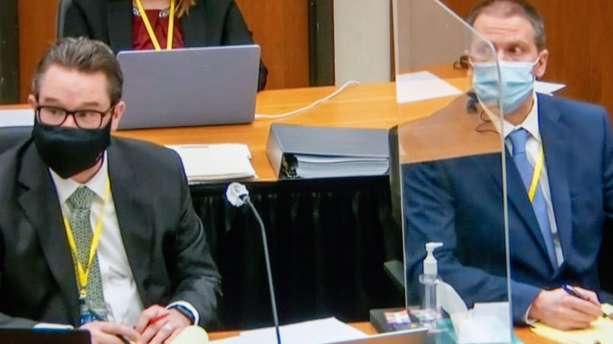 Minneapolis Defense Attorney Eric Nelson (left), and former Minneapolis Police Officer Derek Chauvin, listening to a witness during Chauvin's trial on April 5 in Minneapolis.
