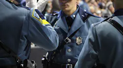 Massachusetts State Police troopers from the 84th Recruit Training Troop receive their badges during a pinning ceremony at the DCU Center in Worcester on Thursday, June 27, 2019.