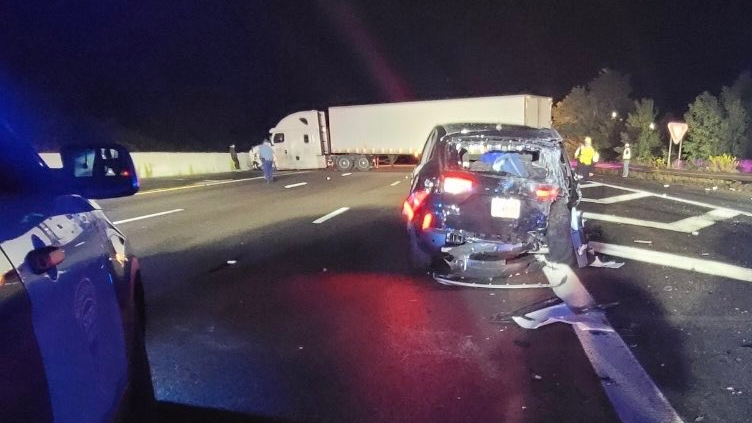 A Massachusetts State Police trooper was seriously injured when his cruiser was struck from behind by a tractor-trailer in a construction zone along Interstate 95 in Weston late Tuesday.