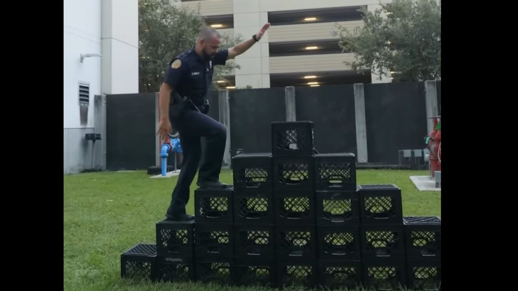 A Miami police officer pretends to try to perform the Milk Crate Challenge in a department video urging the public not to try the online stunt.