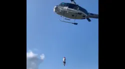 A New York State Police helicopter rescues an injured hiker from a hard-to-reach area of Crane Mountain in the Adirondacks on Sept. 12.