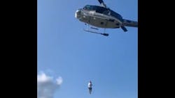 A New York State Police helicopter rescues an injured hiker from a hard-to-reach area of Crane Mountain in the Adirondacks on Sept. 12. A New York State Police helicopter rescues an injured hiker from a hard-to-reach area of Crane Mountain in the Adirondacks on Sept. 12.