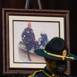 A portrait of St. Petersburg, FL, Police Officer, Michael Weiskopf, who died of complications from COVID-19, is pictured at his funeral at The Coliseum on Tuesday. A portrait of St. Petersburg, FL, Police Officer, Michael Weiskopf, who died of complications from COVID-19, is pictured at his funeral at The Coliseum on Tuesday.