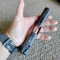 The slide could be mounted on any standard 3rd Gen Glock 17 frame. The rear sight is integral with the cover plate for the optic cut. This is one of the things we noticed first: Mounting an optic means losing the rear sight. The slide could be mounted on any standard 3rd Gen Glock 17 frame. The rear sight is integral with the cover plate for the optic cut. This is one of the things we noticed first: Mounting an optic means losing the rear sight.