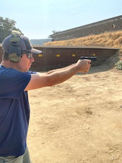 The STK100 has agressive stippling in 4 trapezoidal panels on the grip flats. The gun sits comfortably low in the hand. The gun fit a variety of hand sizes. Even in the large hands of former MLB pitcher Doug Fister, the gun was a great fit. Note that Doug has a level muzzle and there is brass flying in the top right hand corner of the photo.