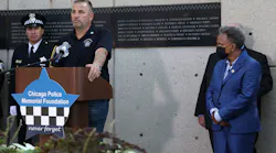 John Catanzara, president of the Chicago Fraternal Order of Police Lodge 7, addresses attendees as Mayor Lori Lightfoot watches during the unveiling of names for five Chicago police officers at the Gold Star Families Memorial and Park in September.