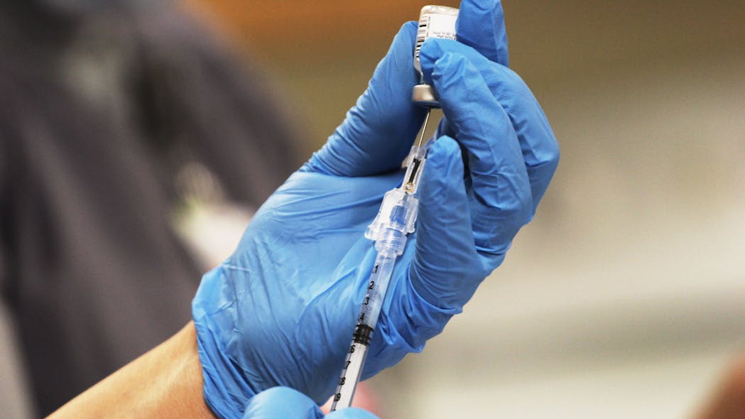 Gadsden, NM, Independent School District nurses prepare the COVID-19 vaccinations at Gadsden High School on Jan. 22.