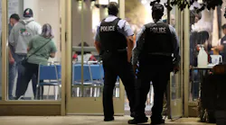 In this file photo, police officers arrive for a meeting at the Fraternal Order of Police Lodge 7 in Chicago on Wednesday.