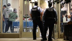 In this file photo, police officers arrive for a meeting at the Fraternal Order of Police Lodge 7 in Chicago on Wednesday. In this file photo, police officers arrive for a meeting at the Fraternal Order of Police Lodge 7 in Chicago on Wednesday.