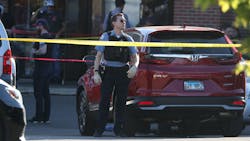 A Chicago police officer at the scene where an officer was shot Monday. A Chicago police officer at the scene where an officer was shot Monday.