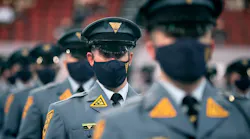 Recruit Scott Livingston (center) sits with other members of his class while listening to a speaker during a ceremony for the 161st New Jersey State Police Class in March.