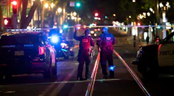Police investigate a July 24 shooting in downtown Portland, OR, near Southwest Fifth Avenue and Washington Street.