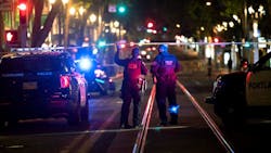 Police investigate a July 24 shooting in downtown Portland, OR, near Southwest Fifth Avenue and Washington Street. Police investigate a July 24 shooting in downtown Portland, OR, near Southwest Fifth Avenue and Washington Street.