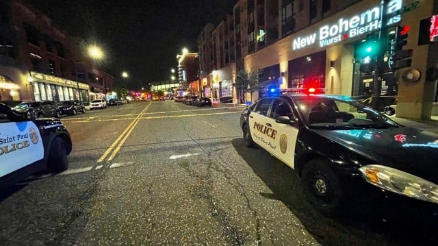 St. Paul, MN, police respond to a shootout at a popular bar early Sunday that left one person dead and 14 others injured.