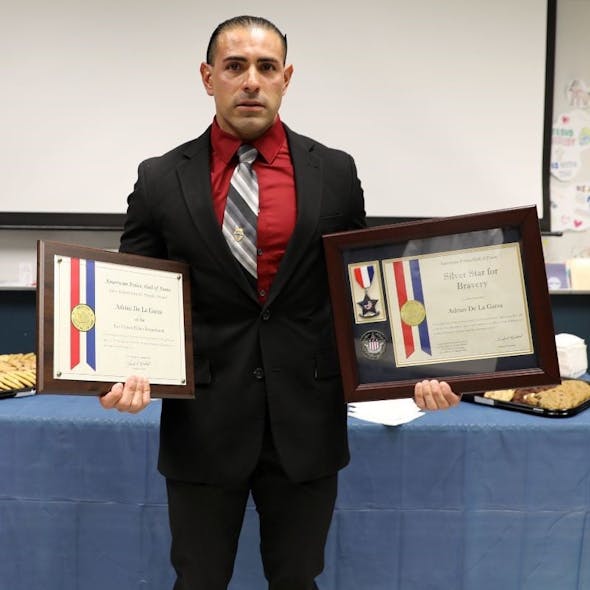 Las Cruces, NM, Police Officer Adrian De La Garza was awarded the Silver Star and the Purple Heart for his efforts while pursuing a man accused of shooting and killing a New Mexico State Police officer in February.